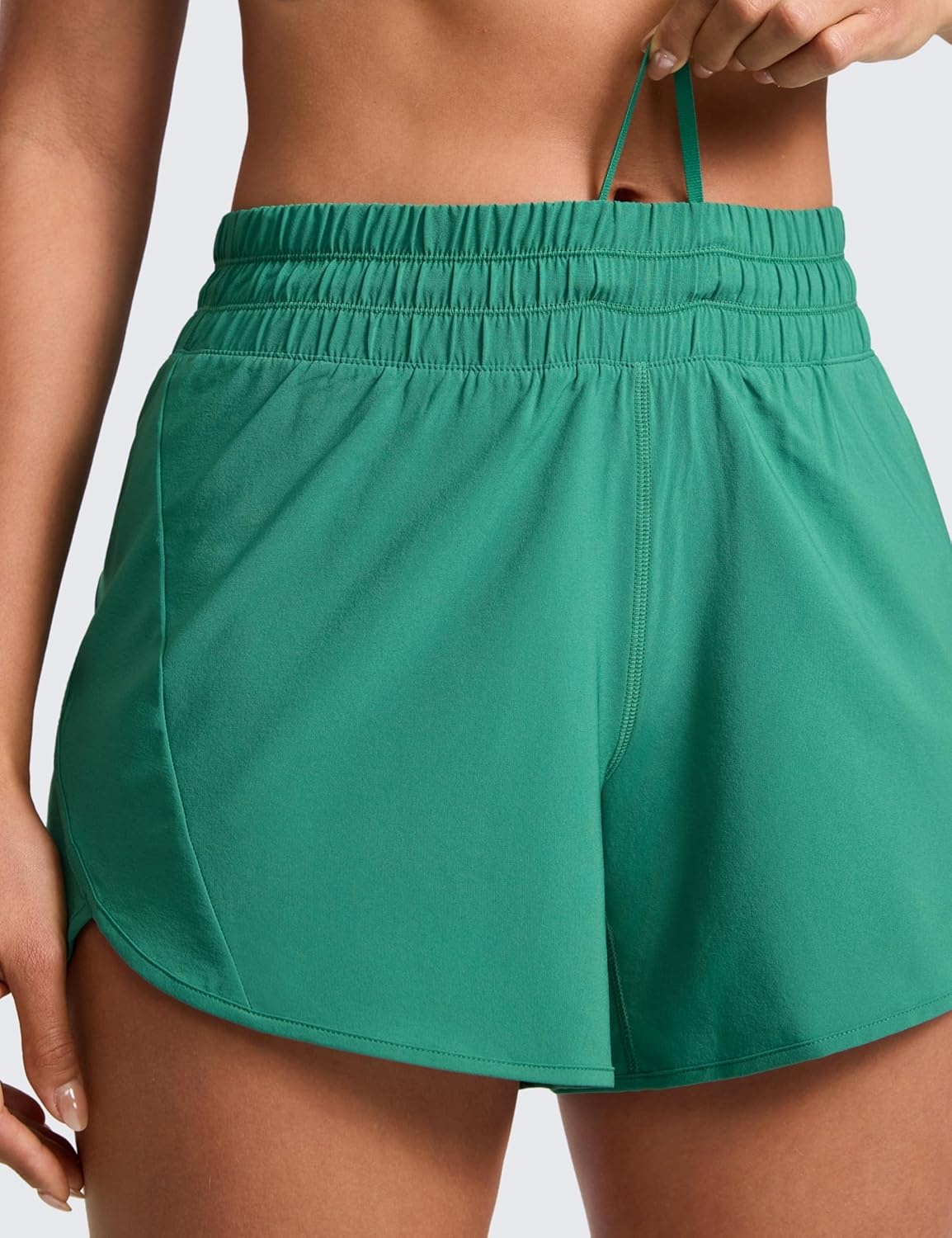 image:imageCRZ YOGA Dolphin Athletic Shorts for Women 5 Mid Waisted Quick Dry for Running Workout Gym Track with Zip PocketCascadia Green