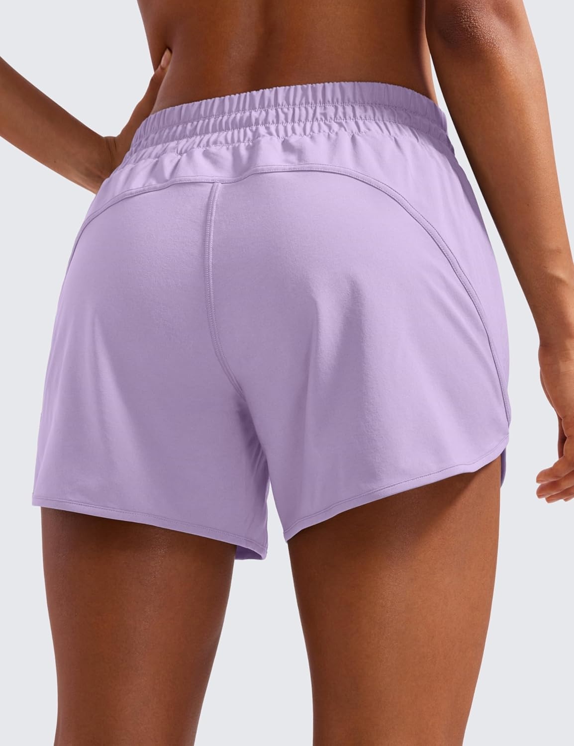 image:imageCRZ YOGA Dolphin Athletic Shorts for Women 5 Mid Waisted Quick Dry for Running Workout Gym Track with Zip PocketLilac