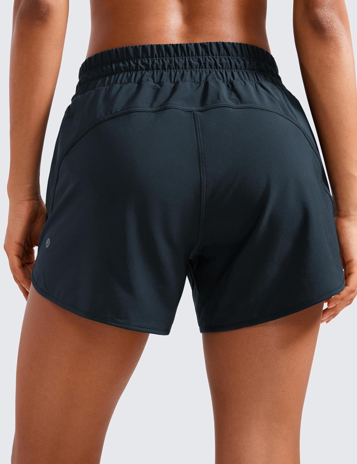 image:imageCRZ YOGA Dolphin Athletic Shorts for Women 5 Mid Waisted Quick Dry for Running Workout Gym Track with Zip PocketTrue Navy