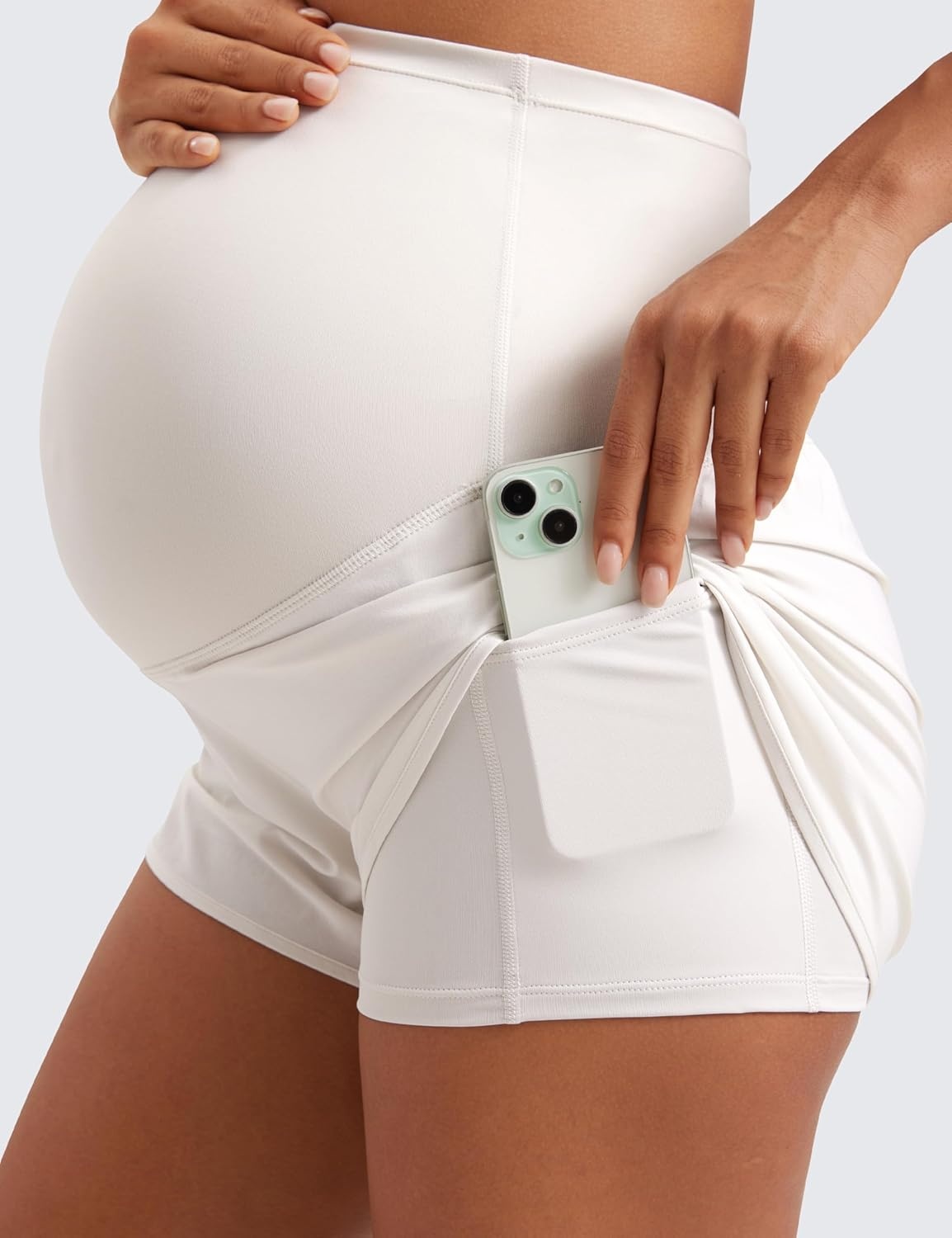 image:imageCRZ YOGA Lightweight Maternity Dolphin Workout Shorts 3 Soft Athletic Running Casual Womens Pregnancy with Liner PocketsMilky White