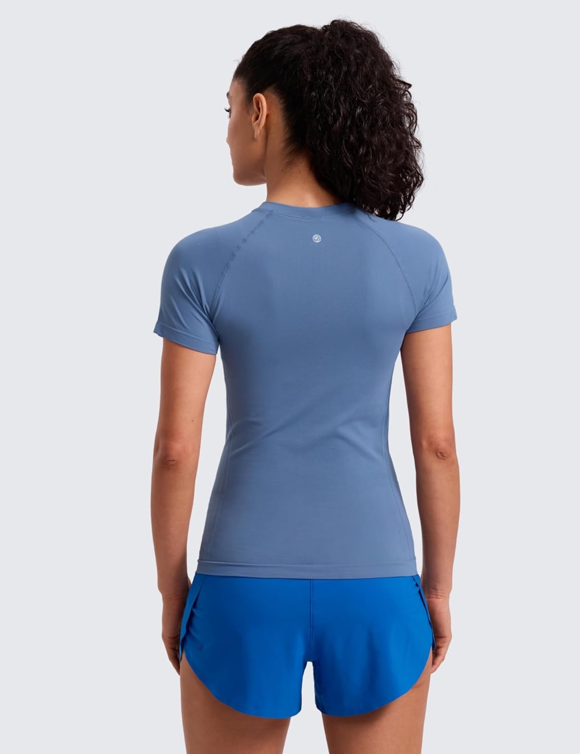 image:imageCRZ YOGA Seamless Workout Tops for Women Hip Length Athletic Running Gym Yoga Short Sleeve Shirts Breathable Crewneck TeesOasis Blue