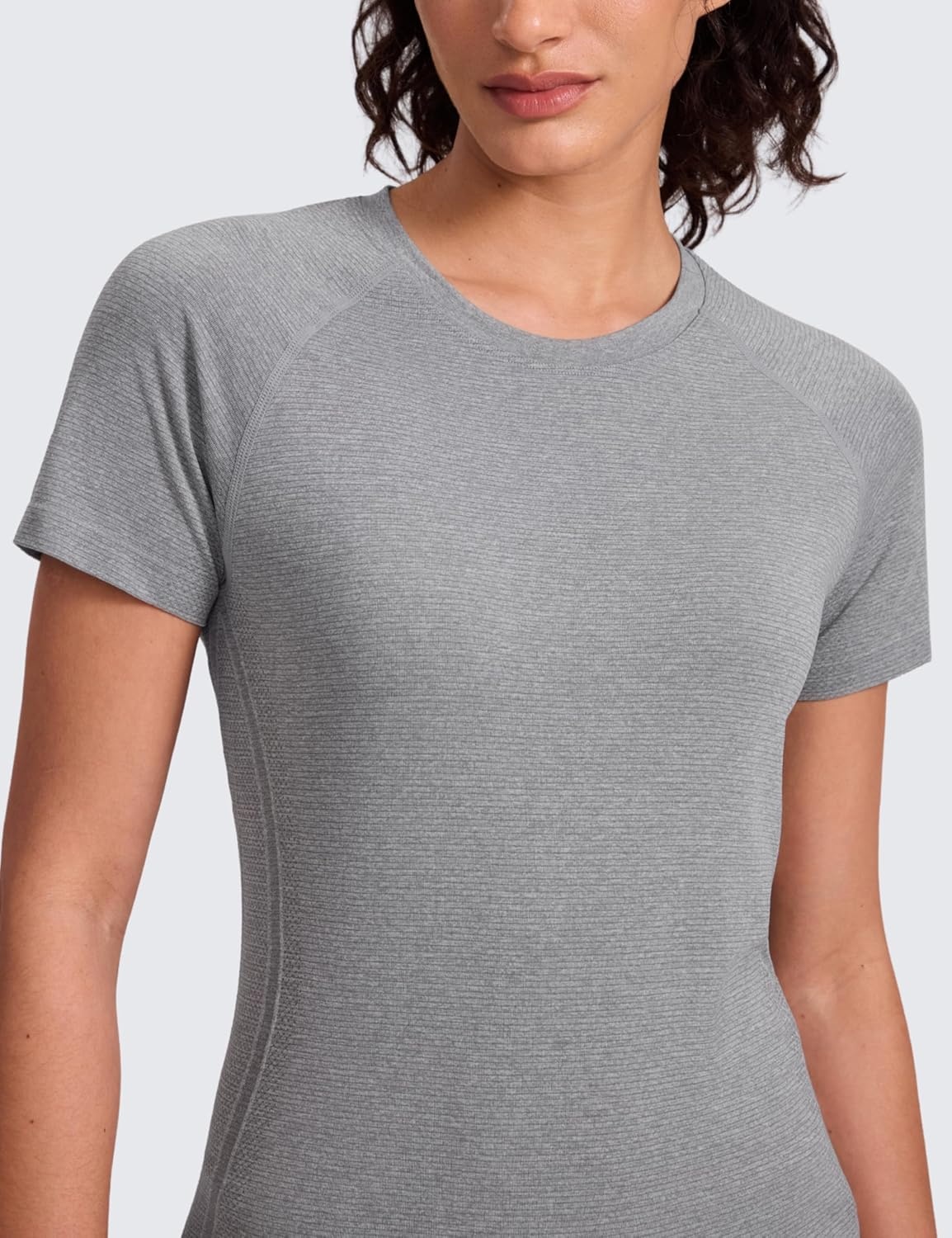 image:imageCRZ YOGA Seamless Workout Tops for Women Hip Length Athletic Running Gym Yoga Short Sleeve Shirts Breathable Crewneck TeesSlate Grey Marl