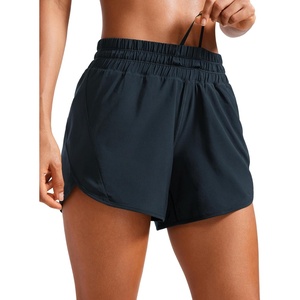 CRZ YOGA Dolphin Athletic Shorts for Women 5″ – Mid Waisted Quick Dry for Running Workout Gym Track with Zip Pocket(True Navy)