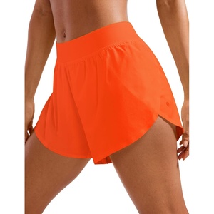 CRZ YOGA Mid Waisted Split Running Shorts for Women 4″ – Comfy Mesh Liner for Workout Athletic Gym Track Quick Dry(Neon Orange)