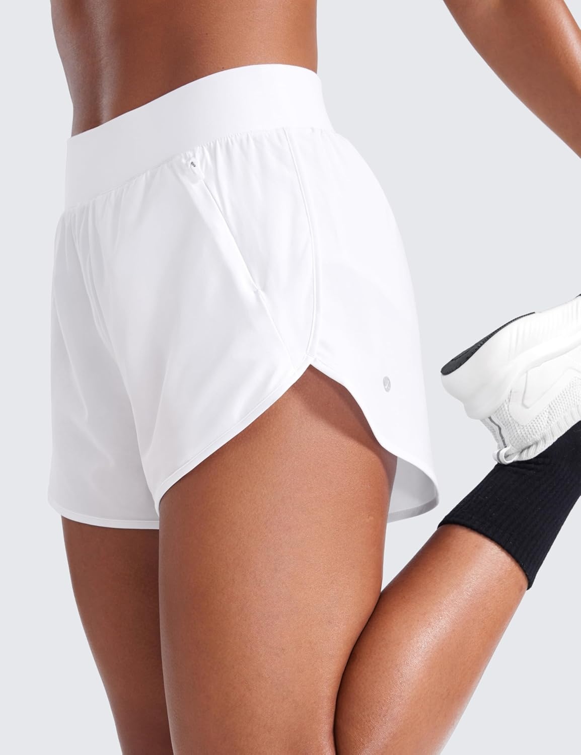 image:imageCRZ YOGA Dolphin Flat Waist Athletic Shorts for Women 3 High Rise Quick Dry for Running Workout Gym Track with Zip PocketsWhite