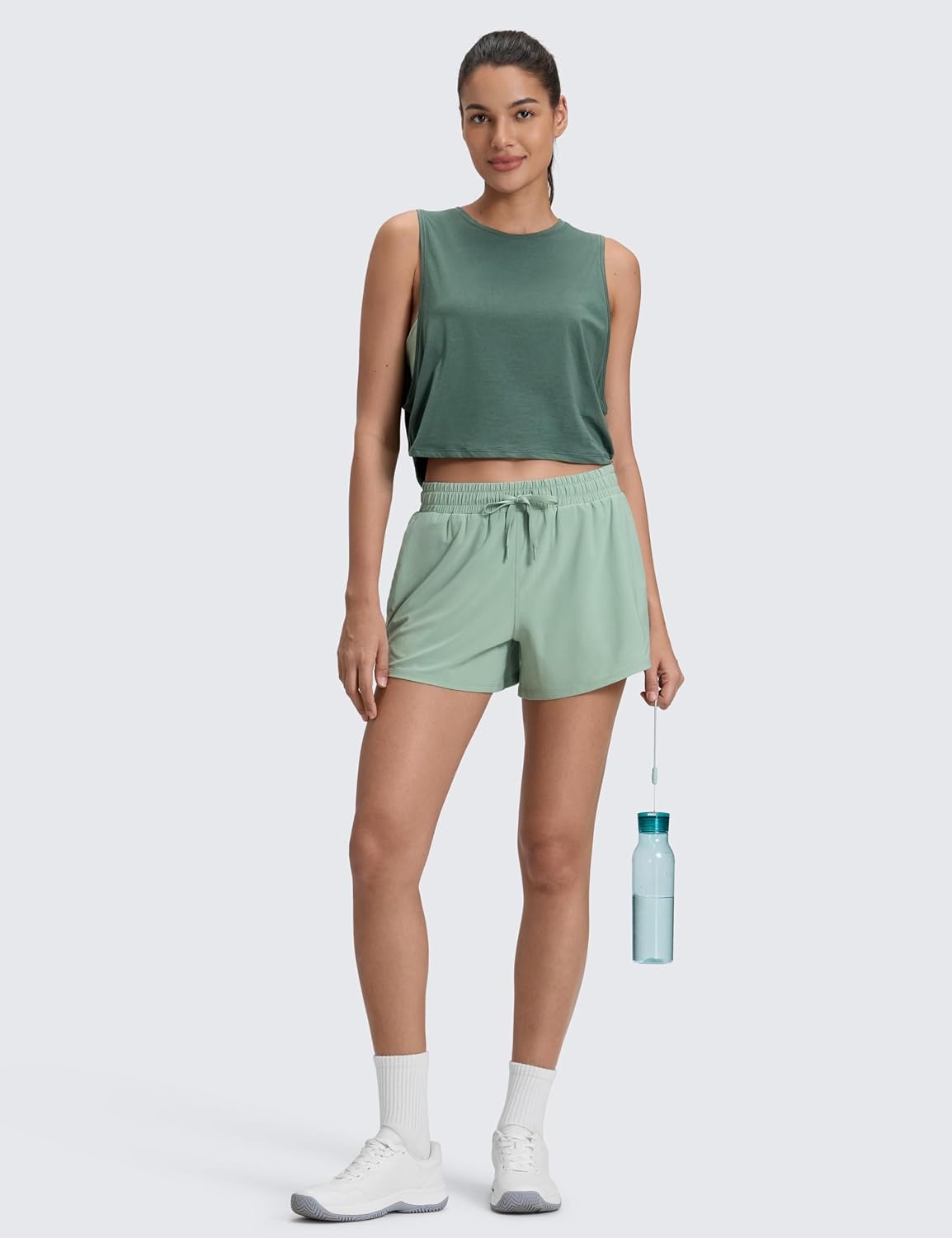 image:imageCRZ YOGA Drapey 2 in 1 Athletic Shorts for Women High Waisted V Slit Casual Tennis Running with PocketsGreen Palm Court