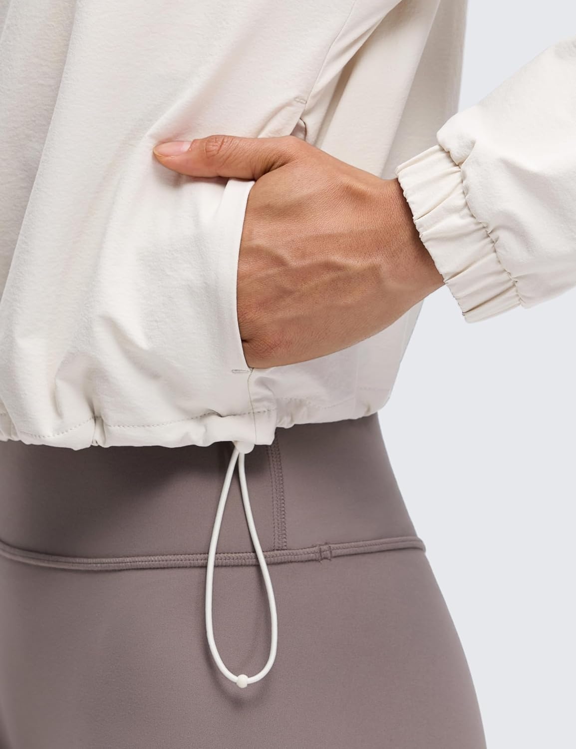 image:imageCRZ YOGA Drawstring Bottom Workout Jackets for Women Half Zip Pullover Cropped Workout Outdoor Tops with PocketsMilky White Bone