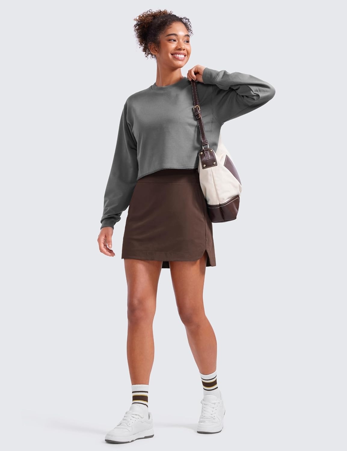 image:imageCRZ YOGA High Waisted Dolphin Golf Skirts for Women Mini Lined A Line Tennis Casual Skort with Side PocketsHot Fudge Brown