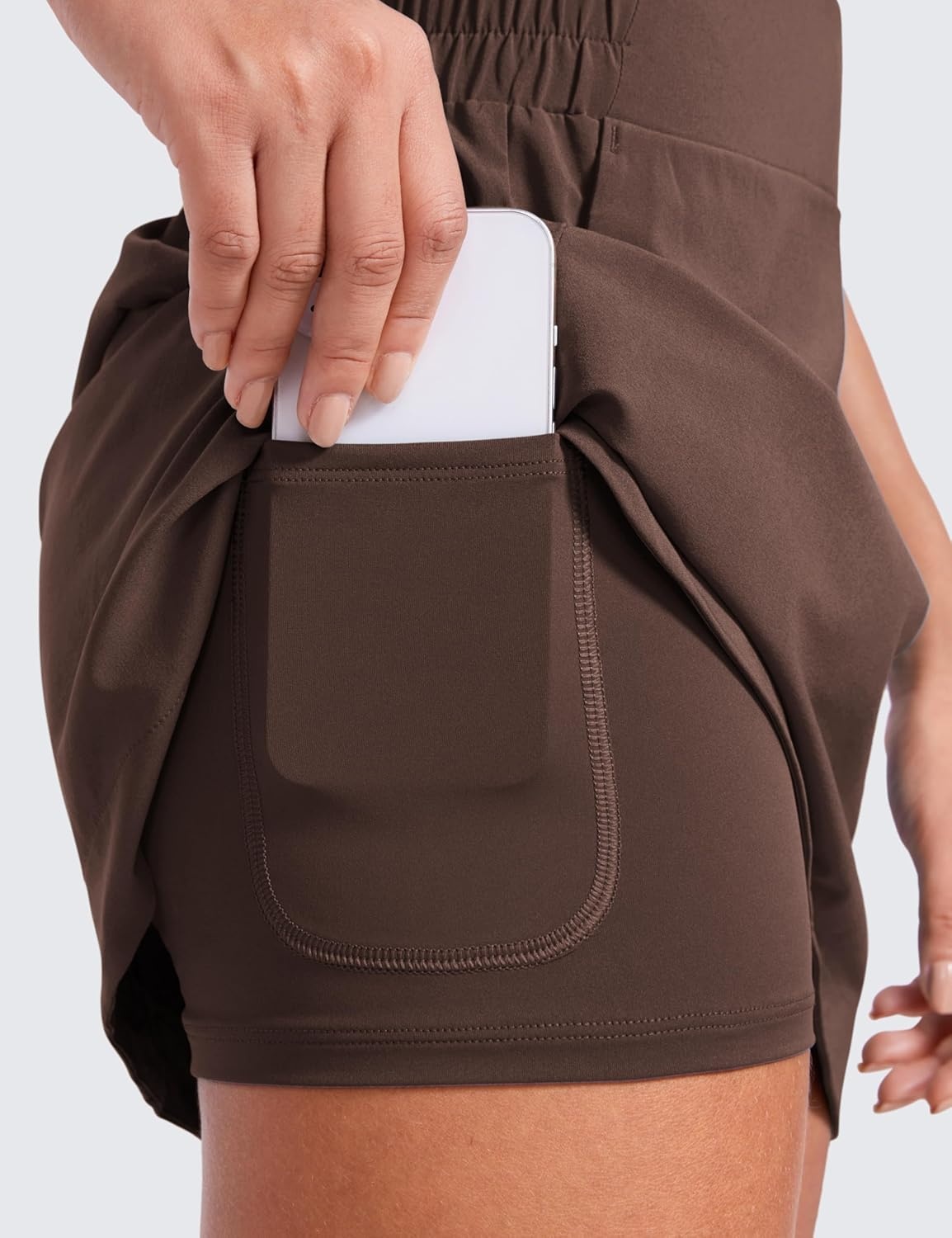 image:imageCRZ YOGA High Waisted Dolphin Golf Skirts for Women Mini Lined A Line Tennis Casual Skort with Side PocketsHot Fudge Brown