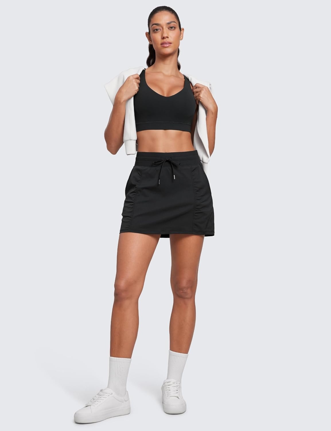 image:imageCRZ YOGA Lightweight Ruched Casual Skirts for Women High Waisted Mini A Line Golf Drawstring Skort with PocketsBlack
