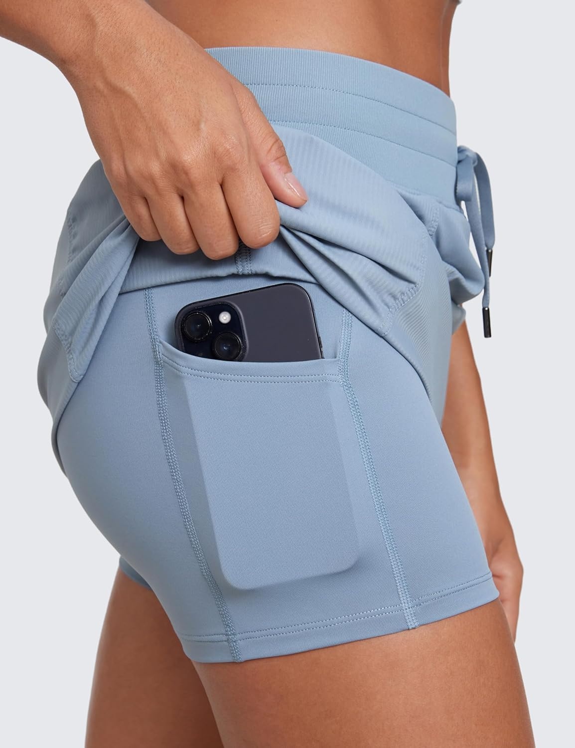 image:imageCRZ YOGA Lightweight Ruched Casual Skirts for Women High Waisted Mini A Line Golf Drawstring Skort with PocketsCambric Blue