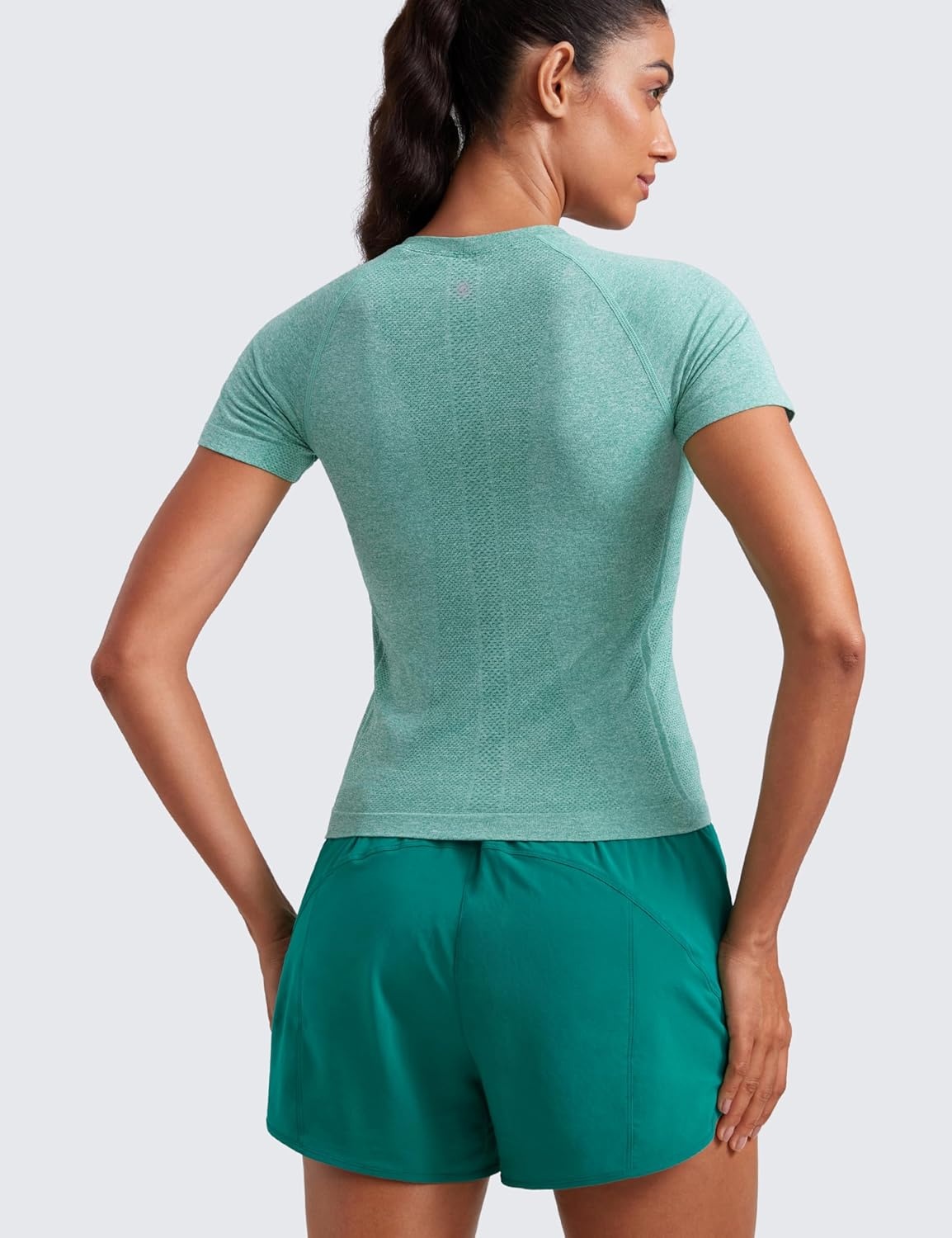 image:imageCRZ YOGA Seamless Workout Tops for Women Waist Length Running Gym Athletic Yoga Short Sleeve Shirts Breathable CrewneckCascadia Green Heather