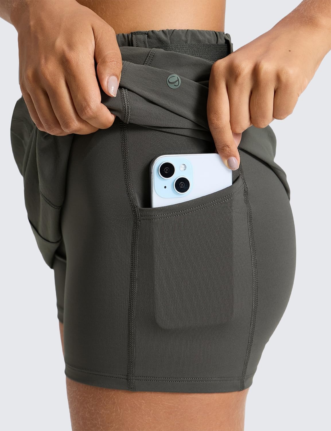image:imageCRZ YOGA Stretch Adjustable Waist Hiking Skirts for Women Mini Lined High Rise Quick Dry Casual Skorts with Zipper PocketsArbor Olive