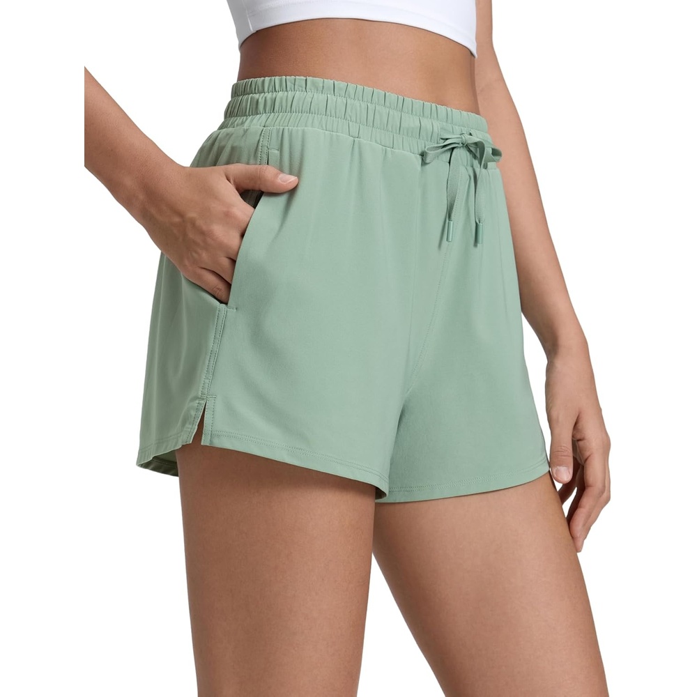 image:imageCRZ YOGA Drapey 2 in 1 Athletic Shorts for Women High Waisted V Slit Casual Tennis Running with PocketsGreen Palm Court