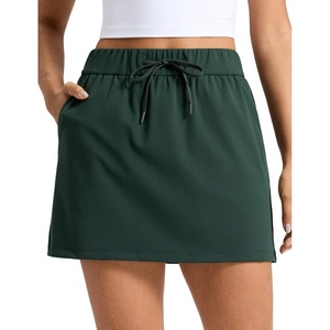 CRZ YOGA 4-Way Stretch A Line Skirts for Women – High Waitsted Mini Lined Tennis Work Drawstring Skort with Pockets(Legend Green)