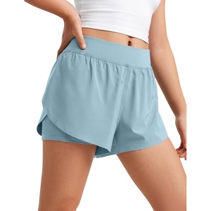 CRZ YOGA Girls Feathery-Fit Soft 2 in 1 Dolphin Athletic Shorts – Tennis Soccer Running Casual Liner Pockets Kids Teen(Light Grayish Blue)